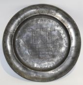 Pewter plate incised with initials and the date 1764 with various maker's marks to base, 22cm diam