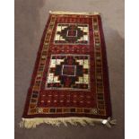 Modern Caucasian Shiraz type carpet, the central panel with two large geometric cruciform lozenges