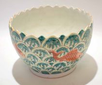 Oriental pottery jardiniere decorated with carp on a green seaweed type background with shaped