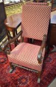 Pair of 18th century walnut throne type carver chairs, upholstered in geometric red and green
