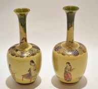 Pair of Japanese pottery vases decorated with geisha type figures, the slender necks with a