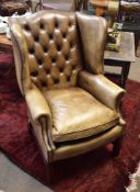 Georgian style mahogany framed leather upholstered wing armchair, circa late 19th/early 20th