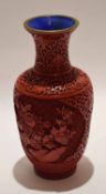 Chinese cloisonne type vase covered with a red lacquer design of flowers within a scroll type