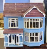 Modern kit dolls house, painted in pale blue, two piece opening front enclosing four room interior