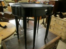 BLACK LACQUERED OVAL SIDE TABLE WITH PULL OUT DRAWER ON TAPERING SQUARE SPADE LEGS