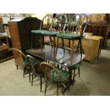 ERCOL RECTANGULAR DINING TABLE TOGETHER WITH A SET OF NINE ERCOL HARD SEATED DINING CHAIRS WITH