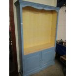 BLUE AND CREAM PAINTED OPEN FRONTED BOOKCASE WITH ADJUSTABLE SHELVES OVER TWO PANELLED CUPBOARD