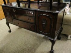 EARLY 20TH CENTURY MAHOGANY SIDEBOARD WITH THREE DRAWERS FLANKED EITHER SIDE BY CARVED PANELLED