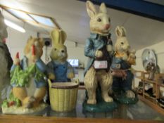 FOUR RESIN BEATRIX POTTER FIGURES OF RABBITS