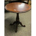 BEECHWOOD FRAMED CIRCULAR TOP TABLE ON A TURNED COLUMN AND A SCROLLING QUATREFOIL BASE