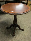 BEECHWOOD FRAMED CIRCULAR TOP TABLE ON A TURNED COLUMN AND A SCROLLING QUATREFOIL BASE