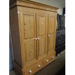 WAXED PINE TRIPLE DOOR WARDROBE WITH TWO DRAWERS TO BASE WITH PORCELAIN KNOB HANDLES