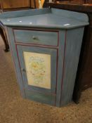 PAINTED PINE CORNER CUPBOARD WITH SINGLE DRAWER AND PAINTED PANELLED CUPBOARD DOOR WITH FRUITS