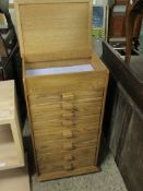 OAK FRAMED LIFT UP TOP COLLECTORS CABINET FITTED WITH EIGHT FULL WIDTH DRAWERS