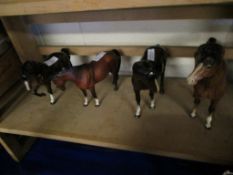 GROUP OF FOUR MIXED BROWN GLAZED BESWICK HORSES