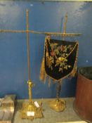 PAIR OF BRASS FRAMED TABLE SCREENS WITH ONE EMBROIDERED PANEL