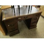 MAHOGANY TWIN PEDESTAL DESK WITH NINE DRAWERS WITH BRASS SWAN NECK HANDLES AND REXINE INSERTED TOP