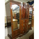 19TH CENTURY COMPENDIUM WARDROBE CENTRALLY FITTED WITH TWO BOW FRONTED CUPBOARD DOORS OVER FOUR