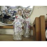 EARLY 20TH CENTURY CONTINENTAL PORCELAIN FIGURES OF A GIRL AND A BOY (2)