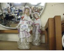 EARLY 20TH CENTURY CONTINENTAL PORCELAIN FIGURES OF A GIRL AND A BOY (2)