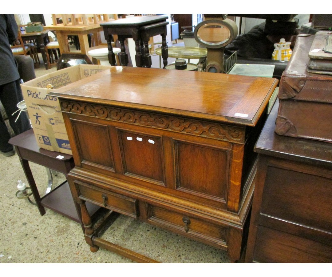 EARLY 20TH CENTURY OAK FRAMED CHEST ON STAND WITH LIFT UP TOP WITH THREE PANELLED FRONT WITH TWO