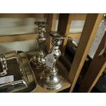 TWO MODERN SILVER ON COPPER SINGLE CANDLESTICKS, EACH WITH DETACHABLE NOZZLES AND URN SHAPED SCONCES