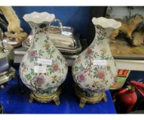PAIR OF ORIENTAL INFLUENCED FLORAL PRINTED VASES ON GILDED STANDS