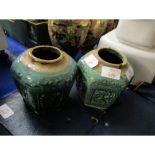 TWO ORIENTAL POTTERY VASES OF FACETED FORM WITH GREEN GLAZED PANELS WITH FLORAL DISPLAYS AND CHINESE