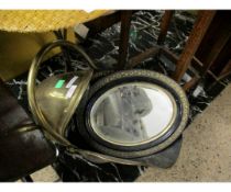 BRASS COAL HELMET TOGETHER WITH A PAIR OF EBONISED OVAL MIRRORS