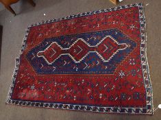 Caucasian style carpet, mainly red and blue field with central geometric panel, double gull