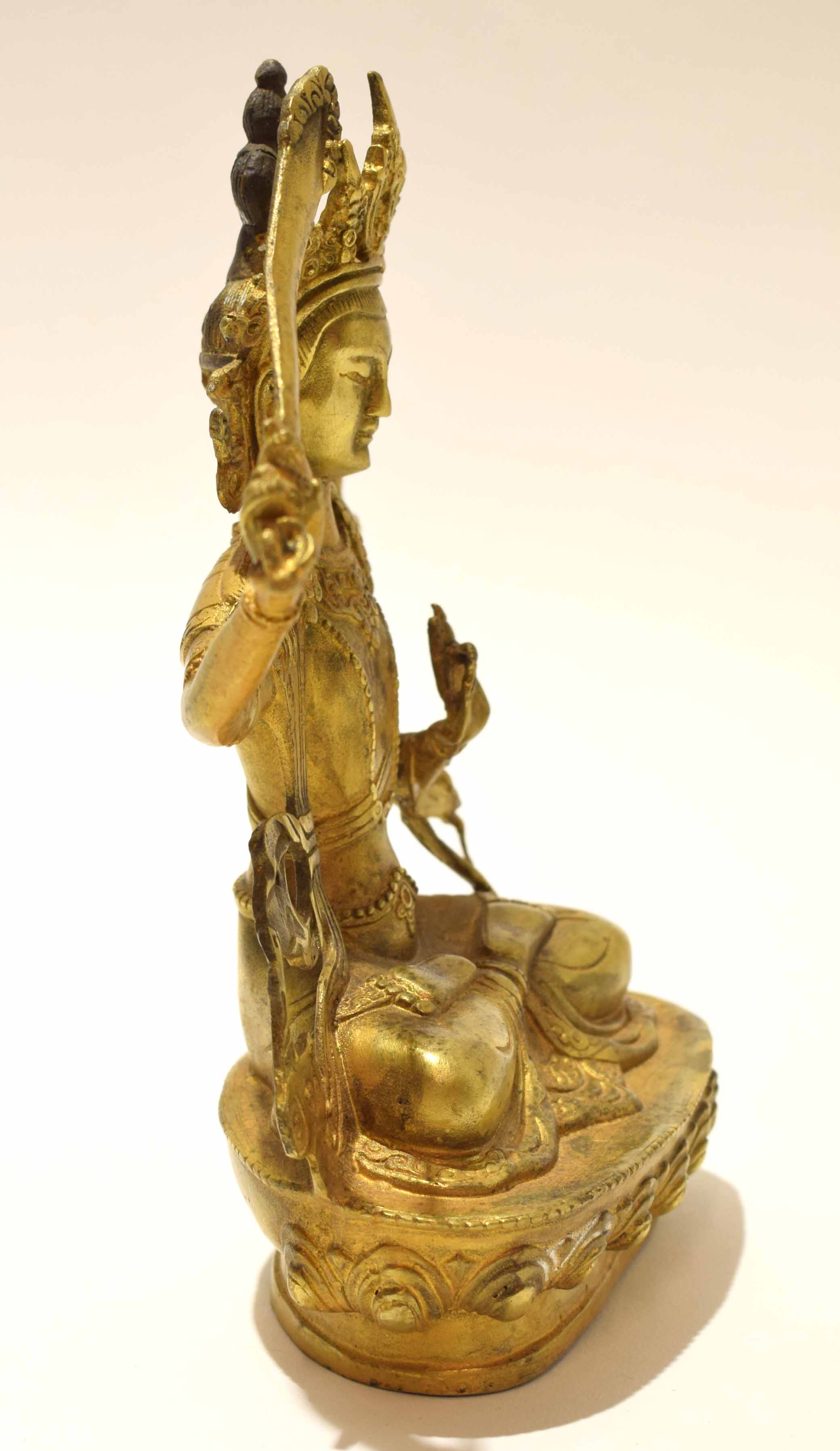 Gilt metal model of a Buddhistic deity in classic pose with inscription to rear, 21cm high - Image 6 of 8