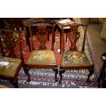 Set of 5 Chippendale style mahogany dining chairs, elaborate pierced splat backs, old tapestry