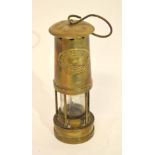 Miner's lamp by Thomas & Williams Ltd, the brass plate marked Cambrian No 33821, 25cm high