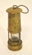 Miner's lamp by Thomas & Williams Ltd, the brass plate marked Cambrian No 33821, 25cm high