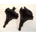 Pair of wooden corner brackets or shelves, with a scrolled design, stained black, 50cm long