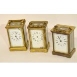 Group of three late 19th/early 20th century brass carriage clocks, white enamel dials and Roman