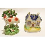 Staffordshire money box modelled as a Staffordshire house, together with an early 19th century