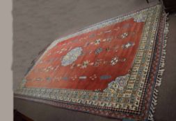 Large Chinese or Indian carpet, central floral lozenge and scattered geometric designs, mainly
