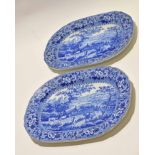 Two pearlware dishes with blue and white design of rural scenes, 38cm long (2)