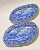 Two pearlware dishes with blue and white design of rural scenes, 38cm long (2)