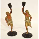 Pair of unusual gilded and painted spelter candlesticks in the form of Indian or Eastern torch