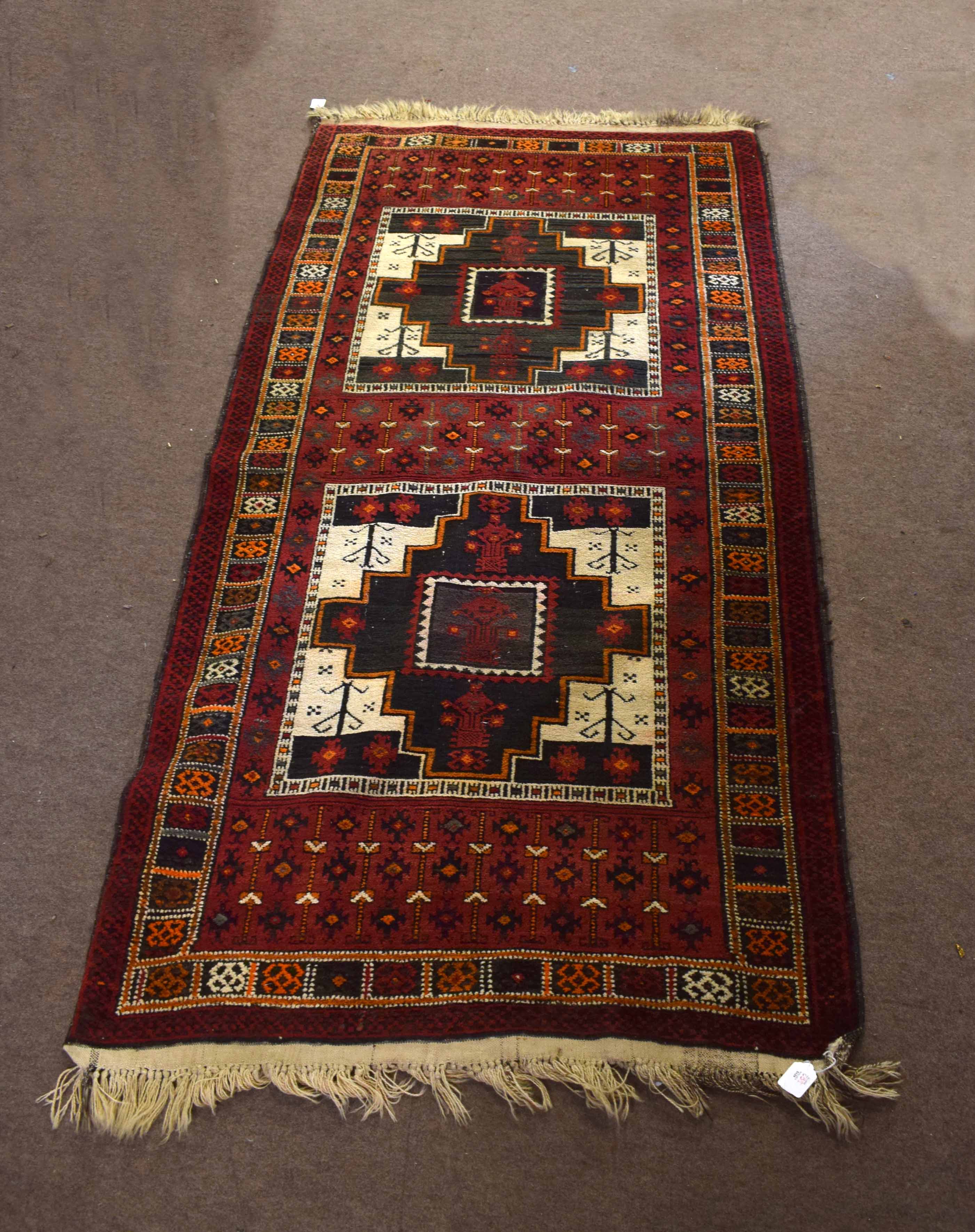 Modern Caucasian Shiraz type carpet, the central panel with two large geometric cruciform lozenges