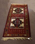 Modern Caucasian Shiraz type carpet, the central panel with two large geometric cruciform lozenges