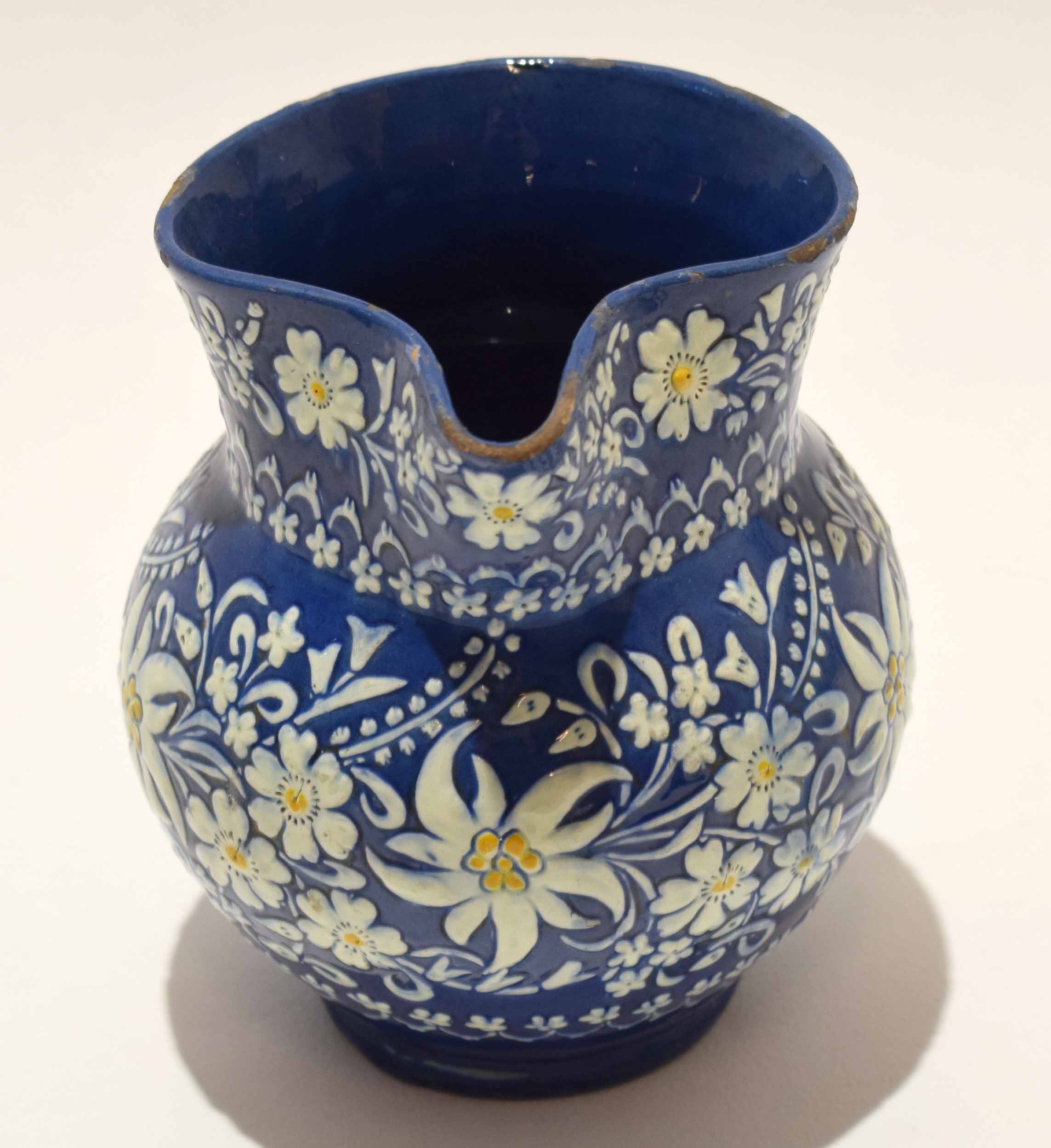 Thune Pottery jug, the blue ground decorated in white with floral sprays, 12cm high - Image 3 of 4