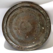Large circular copper charger with Persian or Middle Eastern inscription, 48cm diam