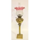 German Veritas brass Corinthian column oil lamp with glass shade with floral decoration and