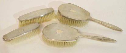 Silver backed dressing table set with four brushes (4)