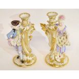 Pair of late 19th century Paris porcelain candlesticks, richly gilt decorated modelled with a lady