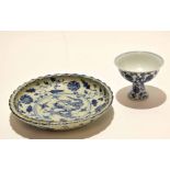 Chinese porcelain stem cup decorated with a blue and white scrolling design in Ming style,