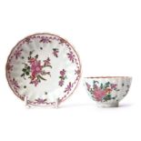 Lowestoft tea bowl and saucer circa 1780, the ribbed body with a floral design, saucer 12cm diam
